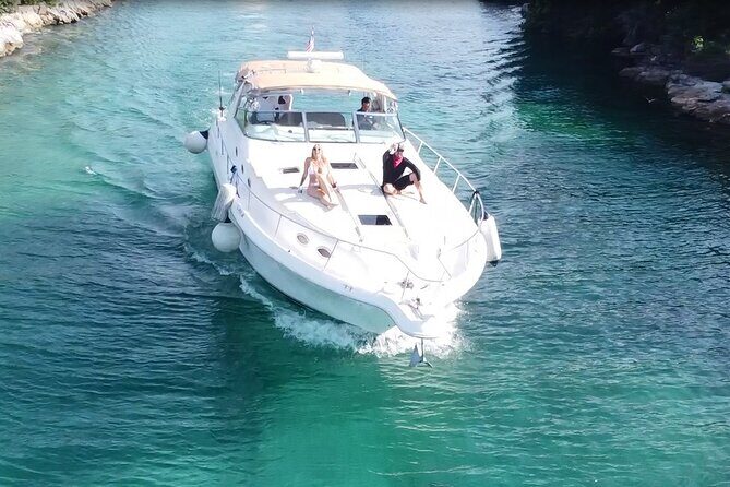 4 hours - Private 48ft Yacht all inclusive in Tulum and Playa del Carmen - Meeting at Puerto Aventuras Hotel & Beach Club: timing you can plan around