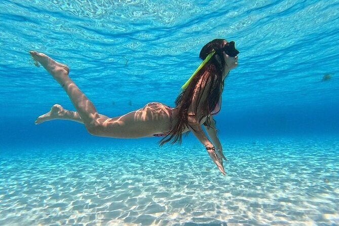 Catamaran in Cozumel with snorkeling at El Cielo and open Bar - Crew, entertainers, and why the ride feels like an event