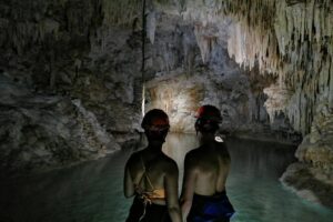 Hidden Cenote exploration in Playa del Carmen - The cave and underground river walk: helmets, lights, and a guide’s storytelling