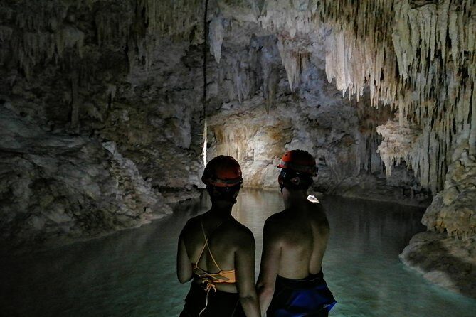 Hidden Cenote exploration in Playa del Carmen - The cave and underground river walk: helmets, lights, and a guide’s storytelling
