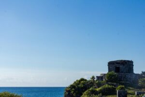 Tulum Bike Tour Tulum Maya Ruins Cenote Swimming Pueblo History Art Tacos Lunch - Stop 1: Tulum Archaeological Site with a Real Maya-Context Guide