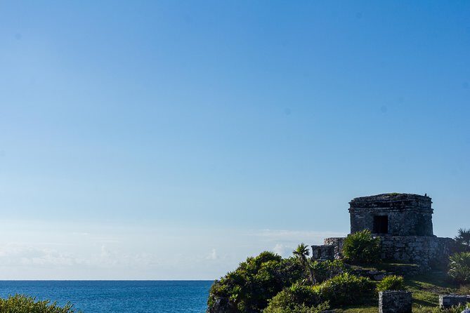 Tulum Bike Tour Tulum Maya Ruins Cenote Swimming Pueblo History Art Tacos Lunch - Stop 1: Tulum Archaeological Site with a Real Maya-Context Guide